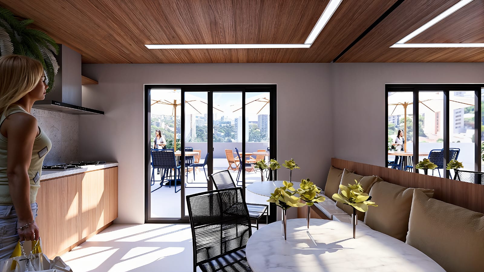 Espaço gourmet com bancada, coifa e integração ao terraço